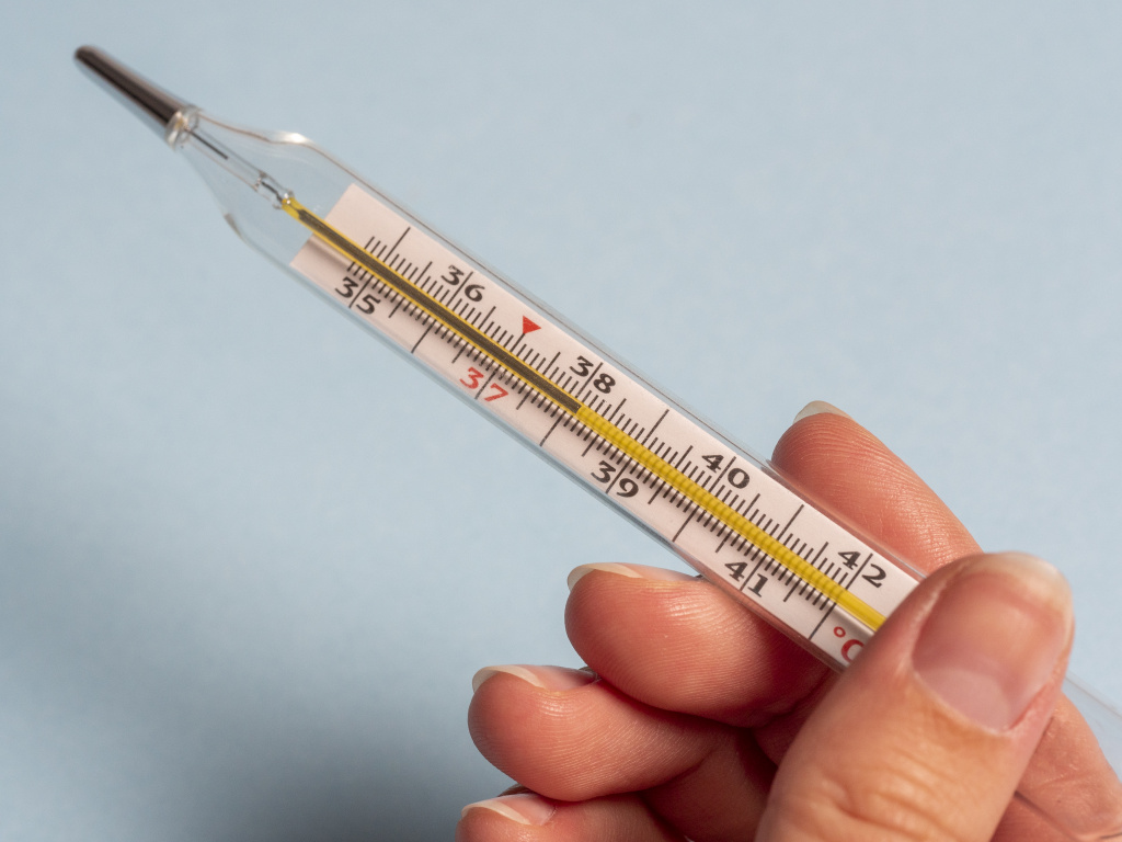 mercury-thermometer-hand-woman-isolated-blue-background.jpg