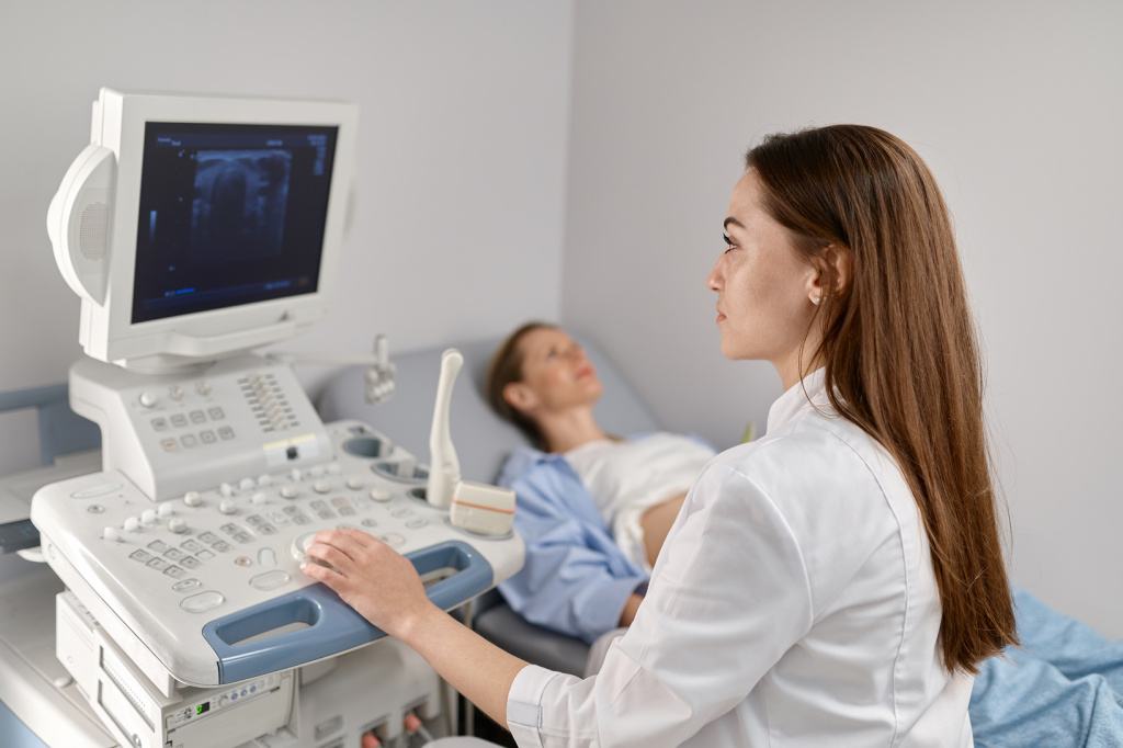 selective-focus-doctor-doing-ultrasound-fetus-pregnant-woman-modern-prenatal-clinic-office 1.jpg selective-focus-doctor-doing-ultrasound-fetus-pregnant-woman-modern-prenatal-clinic-office 1.jpg