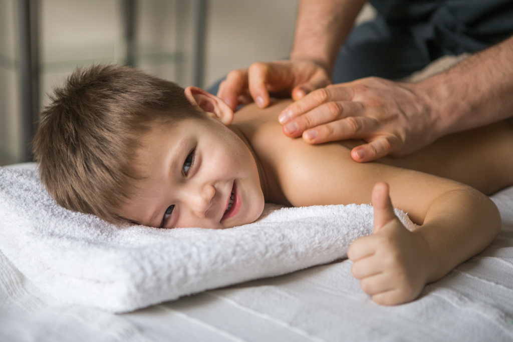 boy-toddler-relaxes-from-therapeutic-massage-physiotherapist-working-with-patient-clinic-back-child.jpg